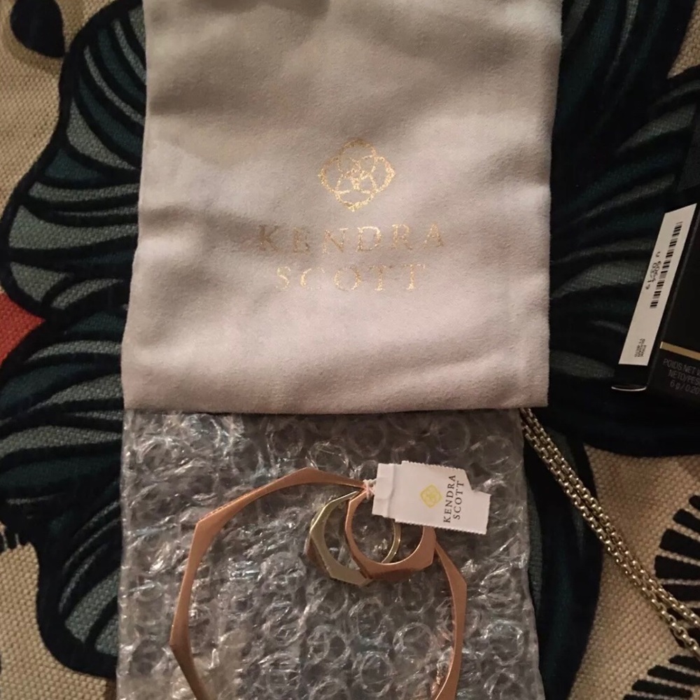A Kendra Scott hexagon shape bracelet and ring